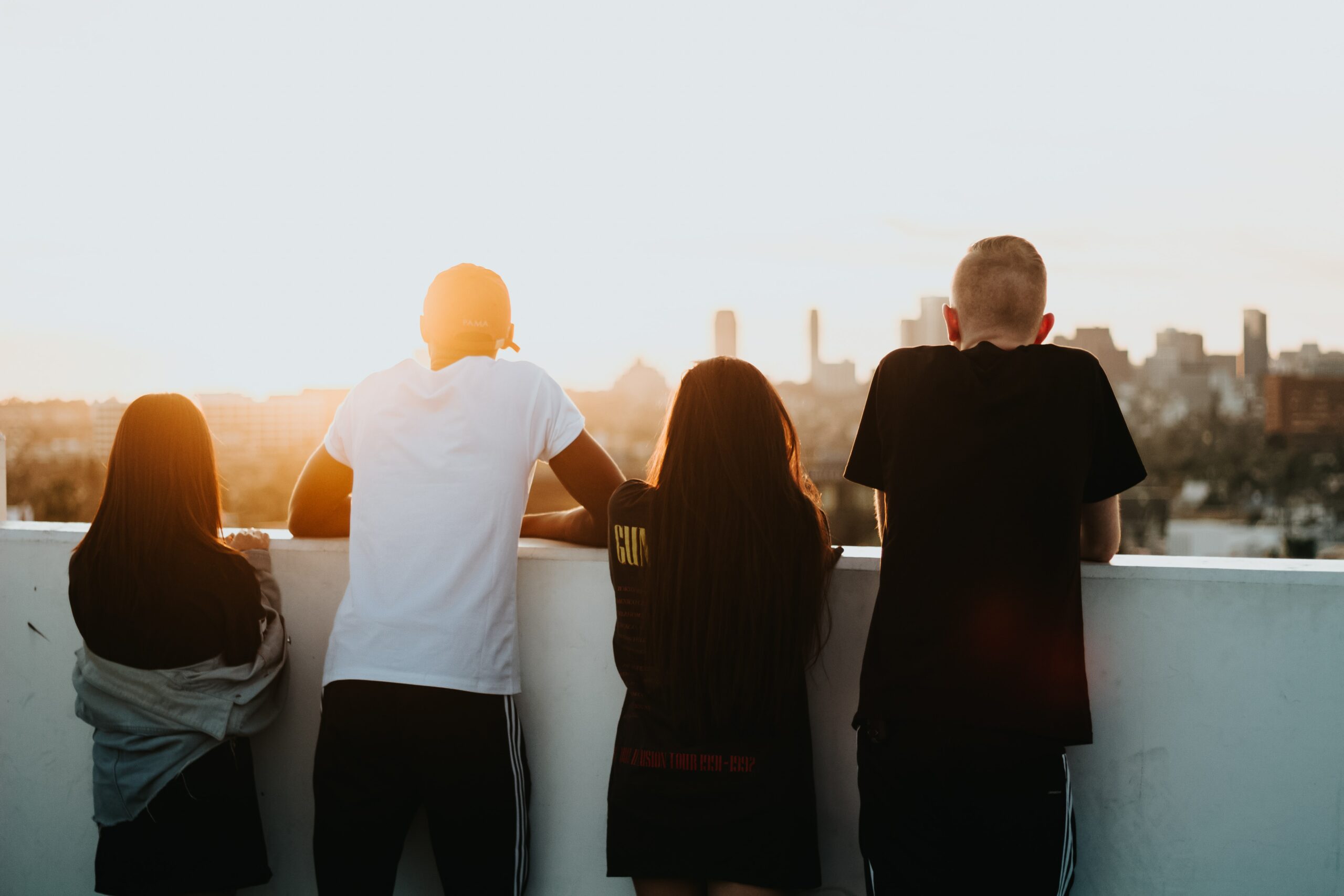 group of friends overlooking a city